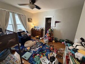 The boys' bedroom before the draft, toys scattered all over the floor and every surface.