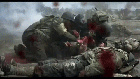 A scene from Saving Private Ryan where medics work to save a soldier on Omaha beach.